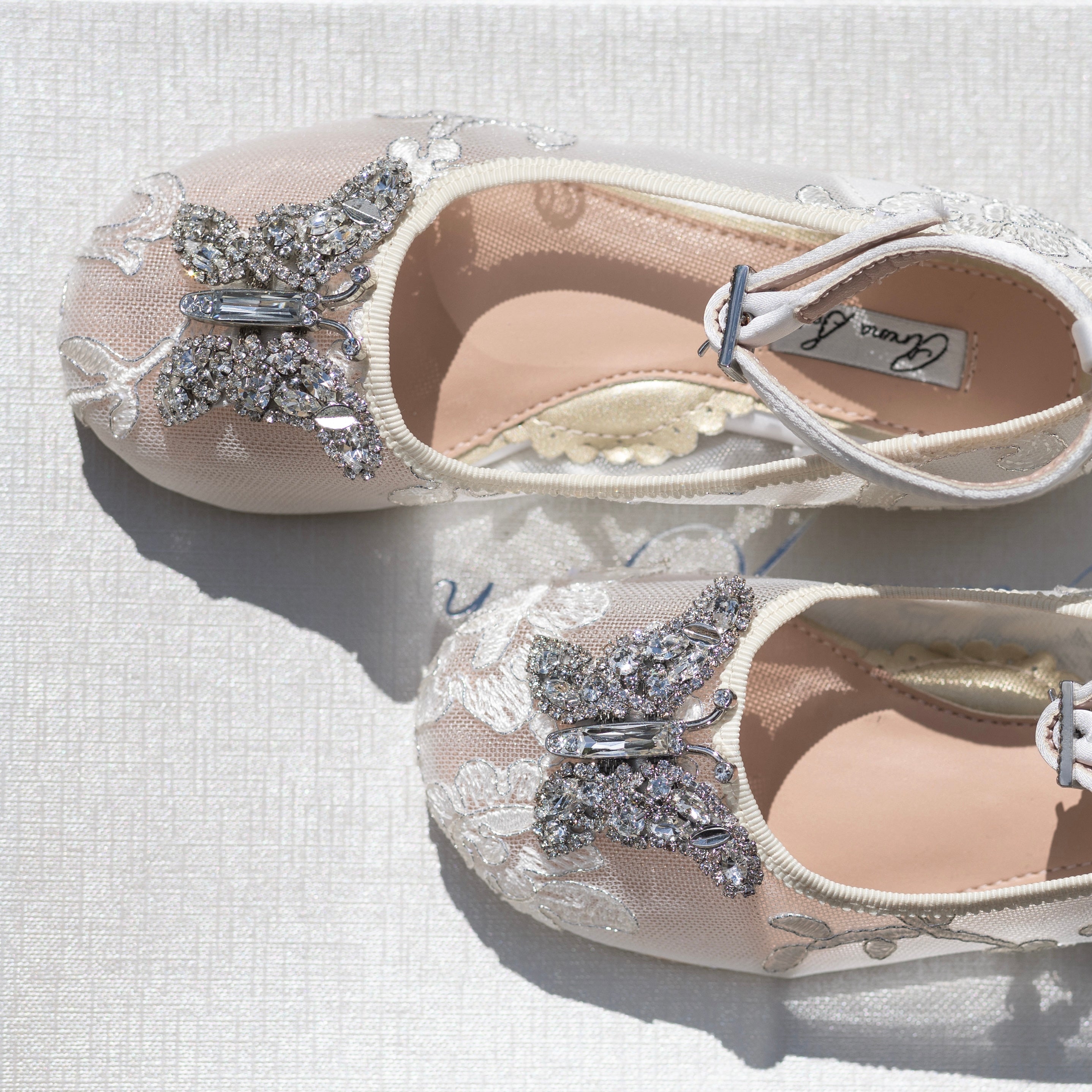 Bridal flower girl shoes in ivory lace, designer wedding collection crafted for elegance and comfort during special occasions.