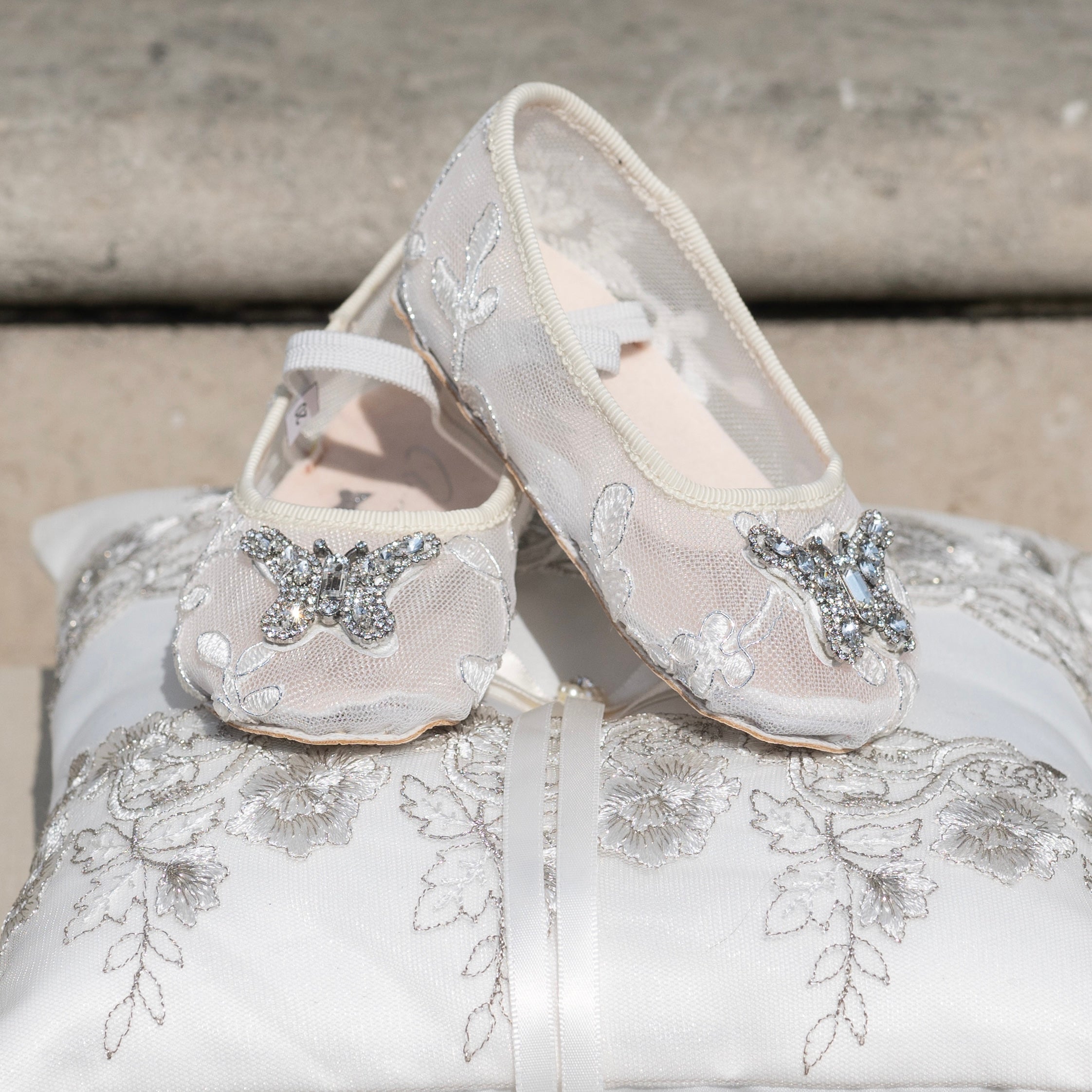 Ivory lace baby Mary Jane shoes, perfect for flower girls and first communion, featuring delicate lace overlay and soft satin for a luxury finish.