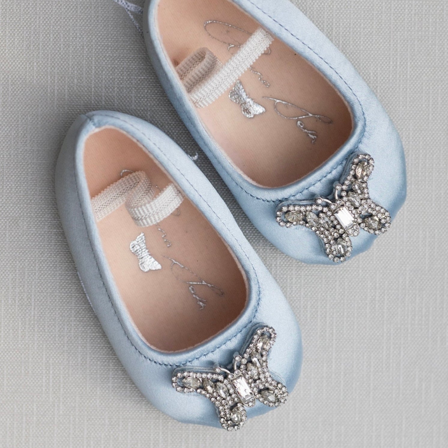 Luxury blue pre-walker baby girl flower shoes, handcrafted with delicate satin, perfect for weddings and special occasions.